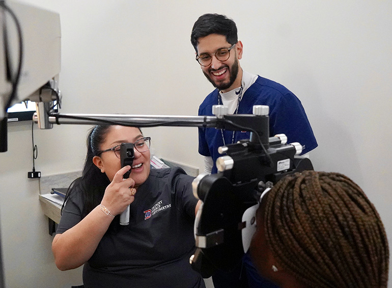 three students practicing exam
