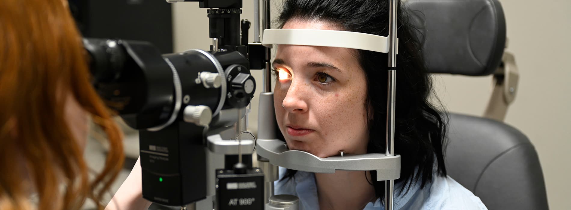 female getting retinal exam